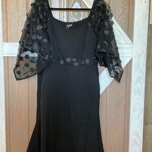 dress. Sheer sleeves with a